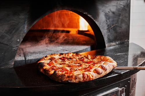 a pizza is being cooked in an oven at The Westin Indianapolis in Indianapolis