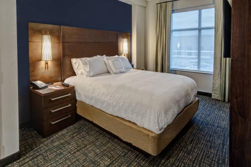 a hotel room with a large bed and a window at Residence Inn by Marriott Nashville Green Hills in Nashville