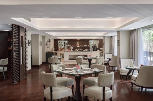 a dining room with a table and chairs at Marriott Mena House, Cairo in Cairo