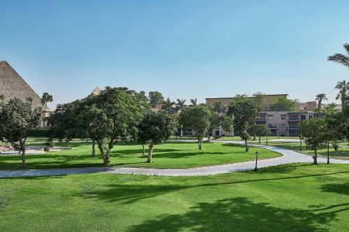a golf course with trees and a road at Marriott Mena House, Cairo in Cairo