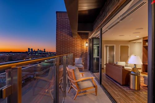 a balcony with a view of the city at dusk at SpringHill Suites by Marriott Fort Worth Historic Stockyards in Fort Worth