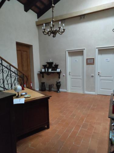 a large room with a table and a chandelier at Casa Tonello Zugliano in Zugliano