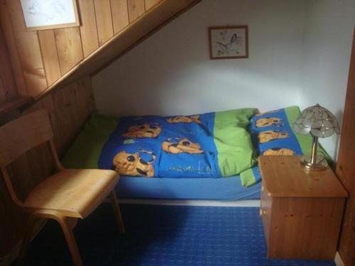a bedroom with a bed with a disney blanket at Alten-Hof in Bischofszell