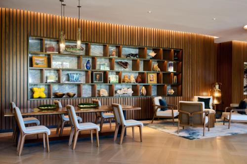 a dining room with a table and chairs at VEA Newport Beach, a Marriott Resort & Spa in Newport Beach