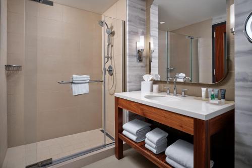 a bathroom with a sink and a shower at JW Marriott Indianapolis in Indianapolis