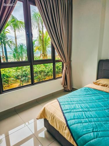 a bedroom with a bed and a large window at BotakCuteHomestay@BaliResidence in Melaka