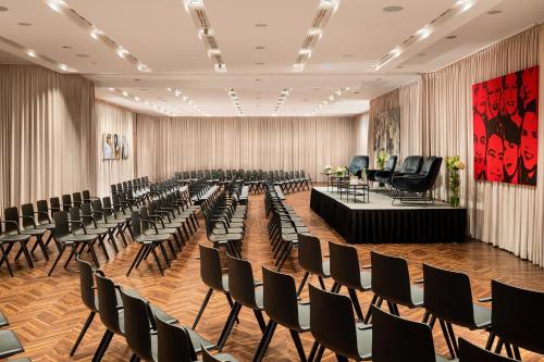 a large room with rows of chairs and desks at Le Méridien Vienna in Vienna