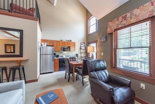 a kitchen and living room with a table and chairs at A308 Studio & Loft Standard View in Oakland