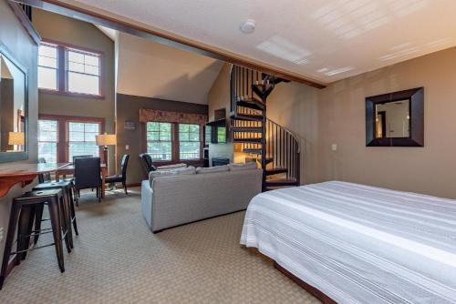 a bedroom with a bed and a living room at A308 Studio & Loft Standard View in Oakland