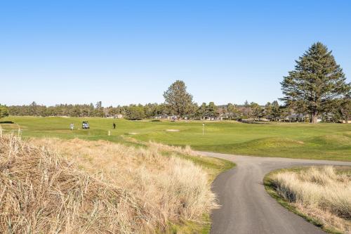 a winding road leading to a golf course at Surfside | Suite on the Sea in Gearhart