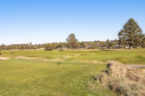 a view of a golf course with a green at Surfside | Suite on the Sea in Gearhart