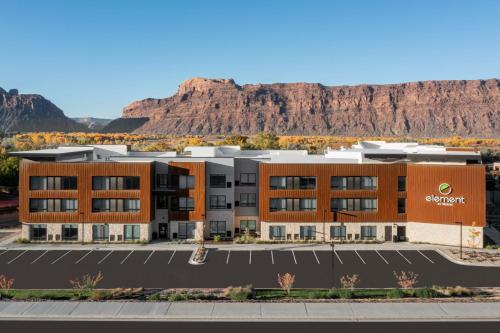 an office building with a mountain in the background at Element Moab in Moab