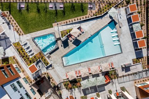 an overhead view of two swimming pools in a building at Element Moab in Moab