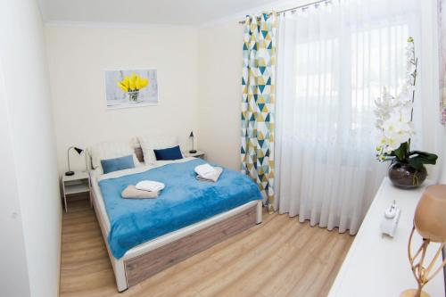 Postel nebo postele na pokoji v ubytování Apartament A1 MODERNO Parking