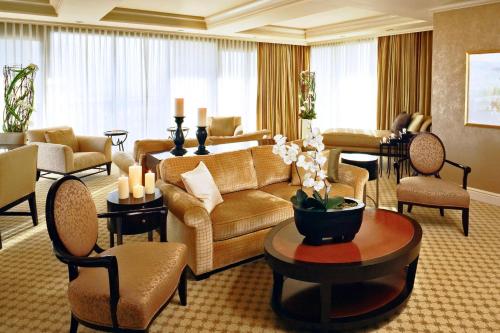 a living room with a couch and chairs and a table at JW Marriott Las Vegas Resort and Spa in Las Vegas