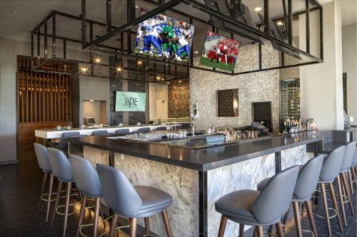 a bar in a restaurant with chairs around it at JW Marriott Las Vegas Resort & Spa in Las Vegas