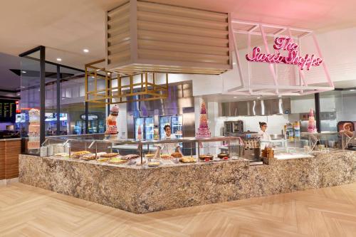 a bakery with a counter with a bunch of pastries at JW Marriott Las Vegas Resort & Spa in Las Vegas