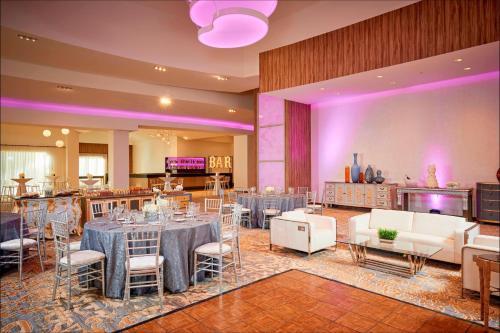 a banquet hall with tables and chairs and purple lighting at JW Marriott Las Vegas Resort & Spa in Las Vegas