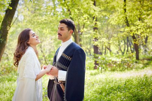 a bride and groom standing next to each other at Paragraph Resort & Spa Shekvetili, Autograph Collection in Shekvetili