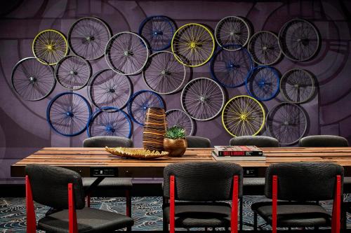 a room with a bunch of bicycles on a wall at Renaissance Nashville Hotel in Nashville