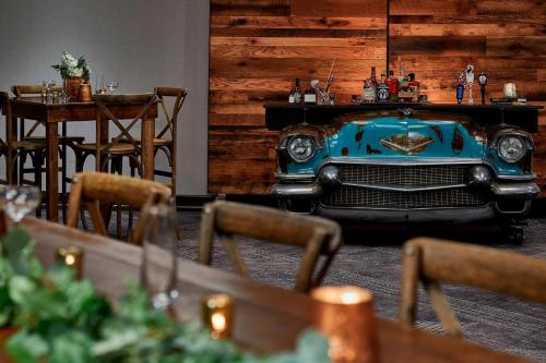 an old blue car parked in a room with tables at Renaissance Nashville Hotel in Nashville