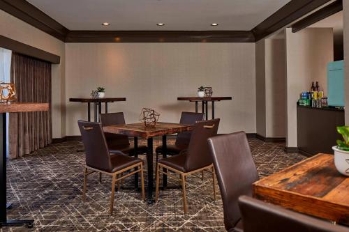 a restaurant with a table and chairs in a room at Renaissance Nashville Hotel in Nashville