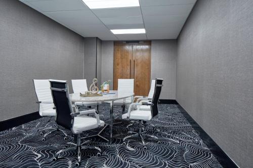 a conference room with a table and chairs on a carpet at Renaissance Nashville Hotel in Nashville