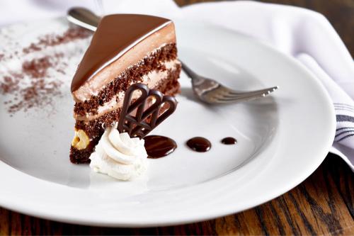 a piece of chocolate cake on a plate with a fork at Renaissance Nashville Hotel in Nashville