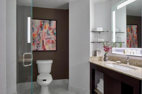 a bathroom with a toilet and a sink at Renaissance Nashville Hotel in Nashville