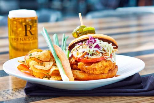 a plate of food with a sandwich and a beer at Renaissance Nashville Hotel in Nashville