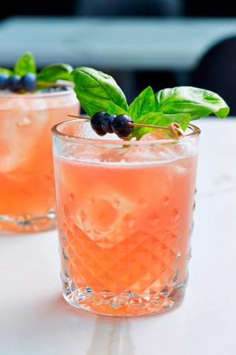 a glass with a drink with a plant in it at Renaissance Nashville Hotel in Nashville