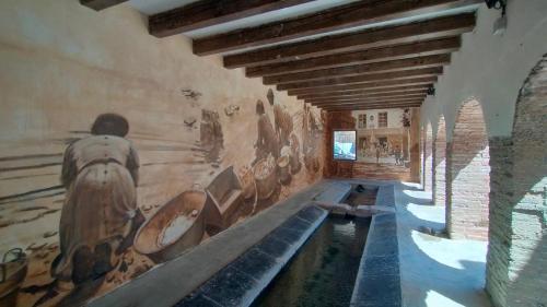 a room with a painting on the walls of a building at Peñas de Arnedillo in Arnedillo