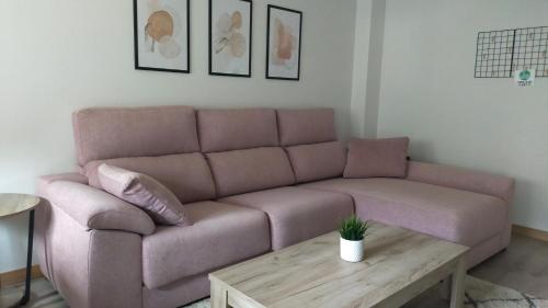 a living room with a couch and a coffee table at Peñas de Arnedillo in Arnedillo