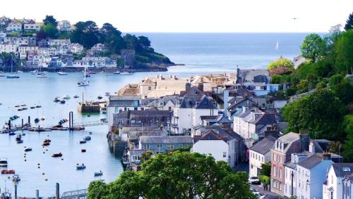 a view of a city with boats in the water at Oystercatcher in Fowey