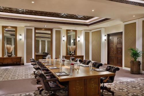 a large conference room with a long table and chairs at Al Wathba, a Luxury Collection Desert Resort & Spa, Abu Dhabi in Abu Dhabi