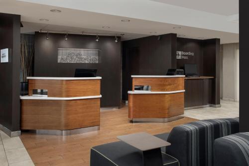 a lobby with a waiting area with desks and chairs at Courtyard by Marriott Portland Tigard in Tigard