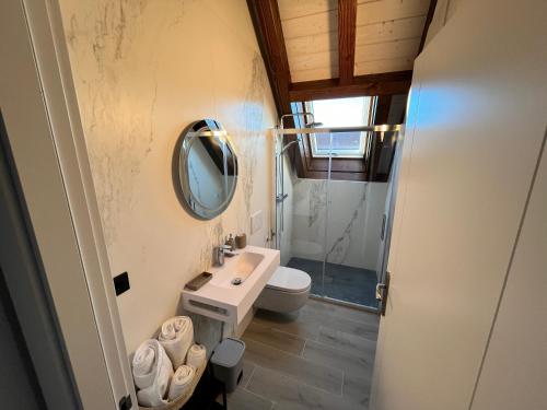 a bathroom with a sink and a mirror at HOTEL RURAL BASQUE IRATI in Espinal-Auzperri