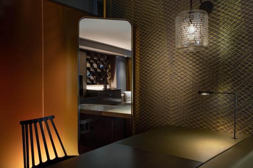 a bathroom with a sink and a mirror at W Philadelphia in Philadelphia