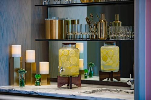 two vases filled with yellow liquid on a table at W Philadelphia in Philadelphia