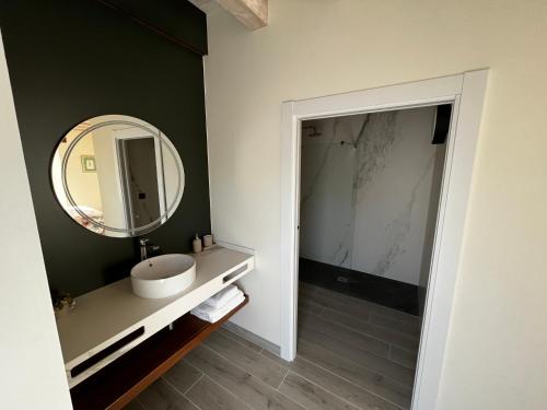 a bathroom with a sink and a mirror at HOTEL RURAL BASQUE IRATI in Espinal-Auzperri