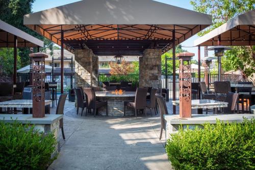a patio with a table and chairs under a pavilion at Courtyard Palo Alto Los Altos in Palo Alto