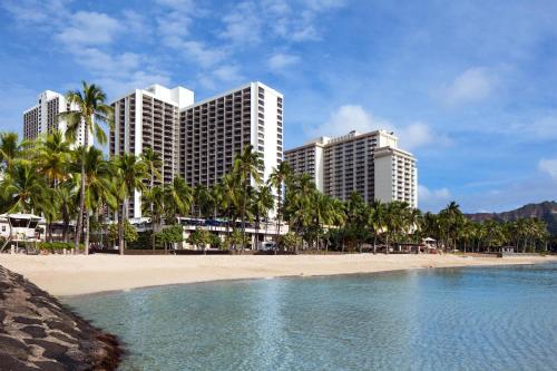 a view of a beach with buildings and palm trees at Waikiki Beach Marriott Resort & Spa in Honolulu
