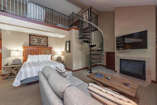 a large bedroom with a bed and a fireplace at A304 Studio & Loft Standard View in Oakland