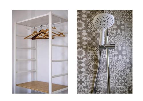 a closet with a shelf and a showeroser at Casa Gemma-quiet and relaxing place in Costa Teguise