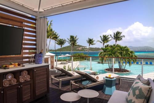 a living room with a view of the ocean at The Ritz-Carlton St. Thomas in Benner