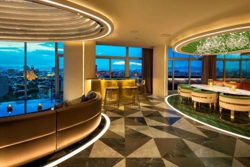a hotel lobby with a view of the city at W Mexico City in Mexico City