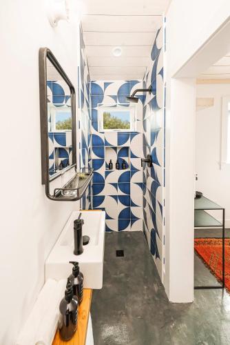 a bathroom with a sink and a mirror at Mini Shortboard Room with a Queen Bed in Stinson Beach