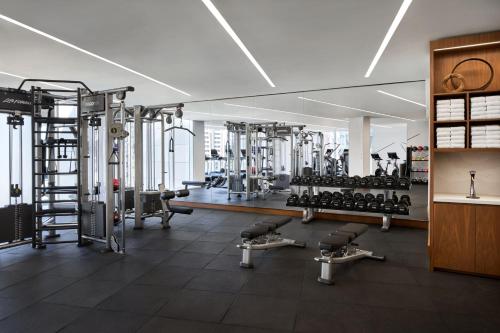 a gym with lots of machines and treadmills at Marriott Bethesda Downtown at Marriott HQ in Bethesda