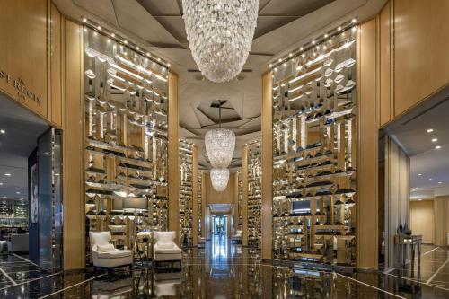 a room with a bunch of wine bottles at The St Regis Bal Harbour Resort in Miami Beach