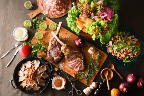 a table with a plate of food and a salad at Yokohama Bay Sheraton Hotel and Towers in Yokohama